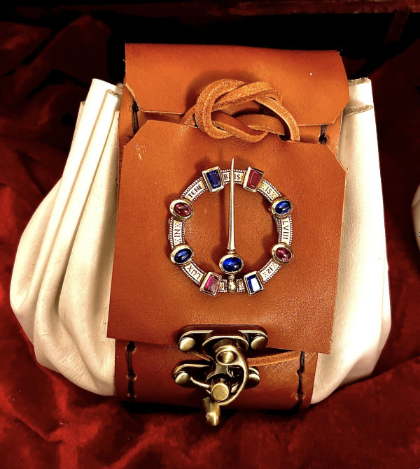 Handmade cash pouch containing £1 and £2 coins